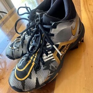 Nike Alpha Menace Boy’s Black and Gold Cleats